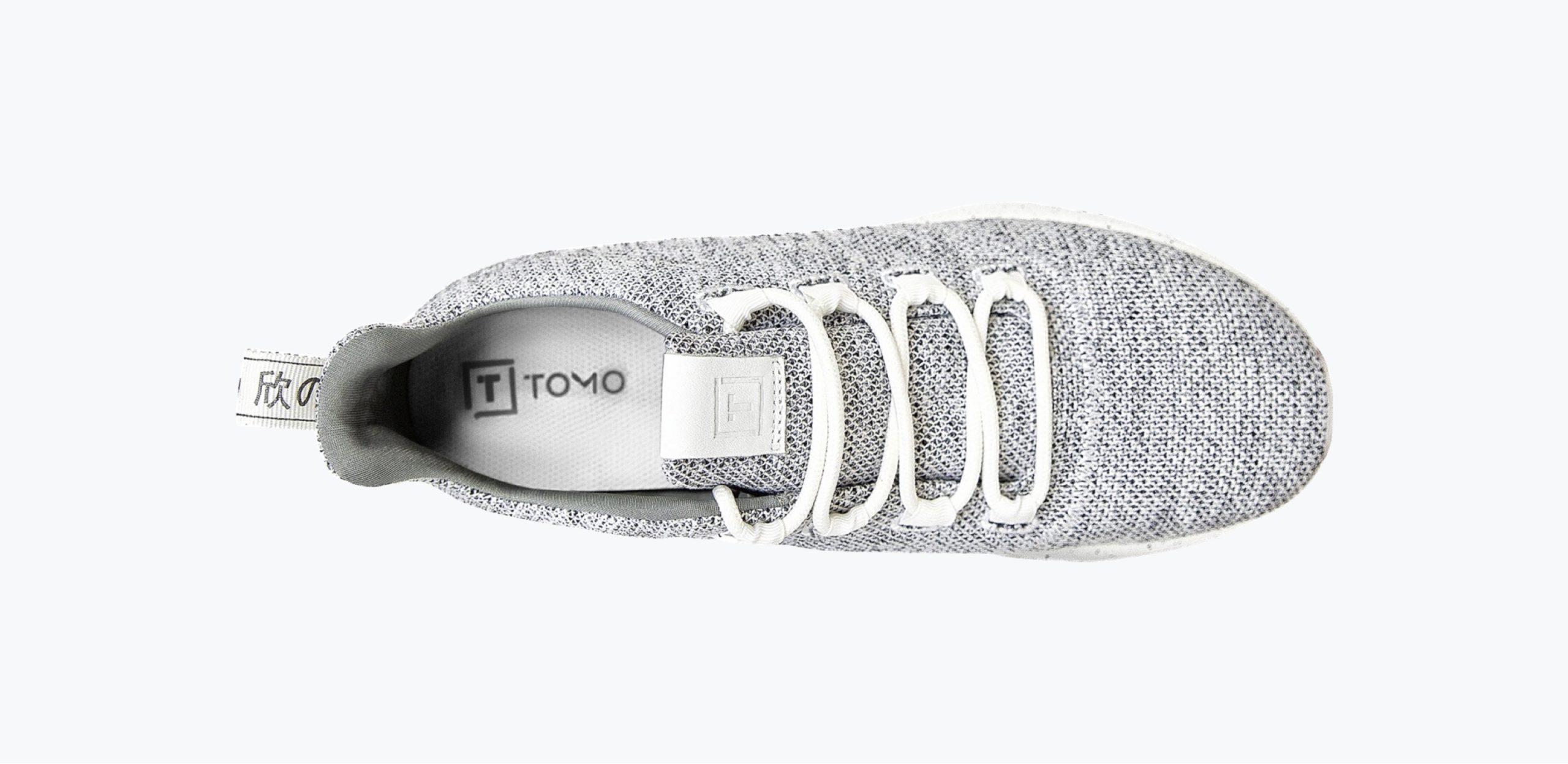 a gray shoe of the brand tomo top view