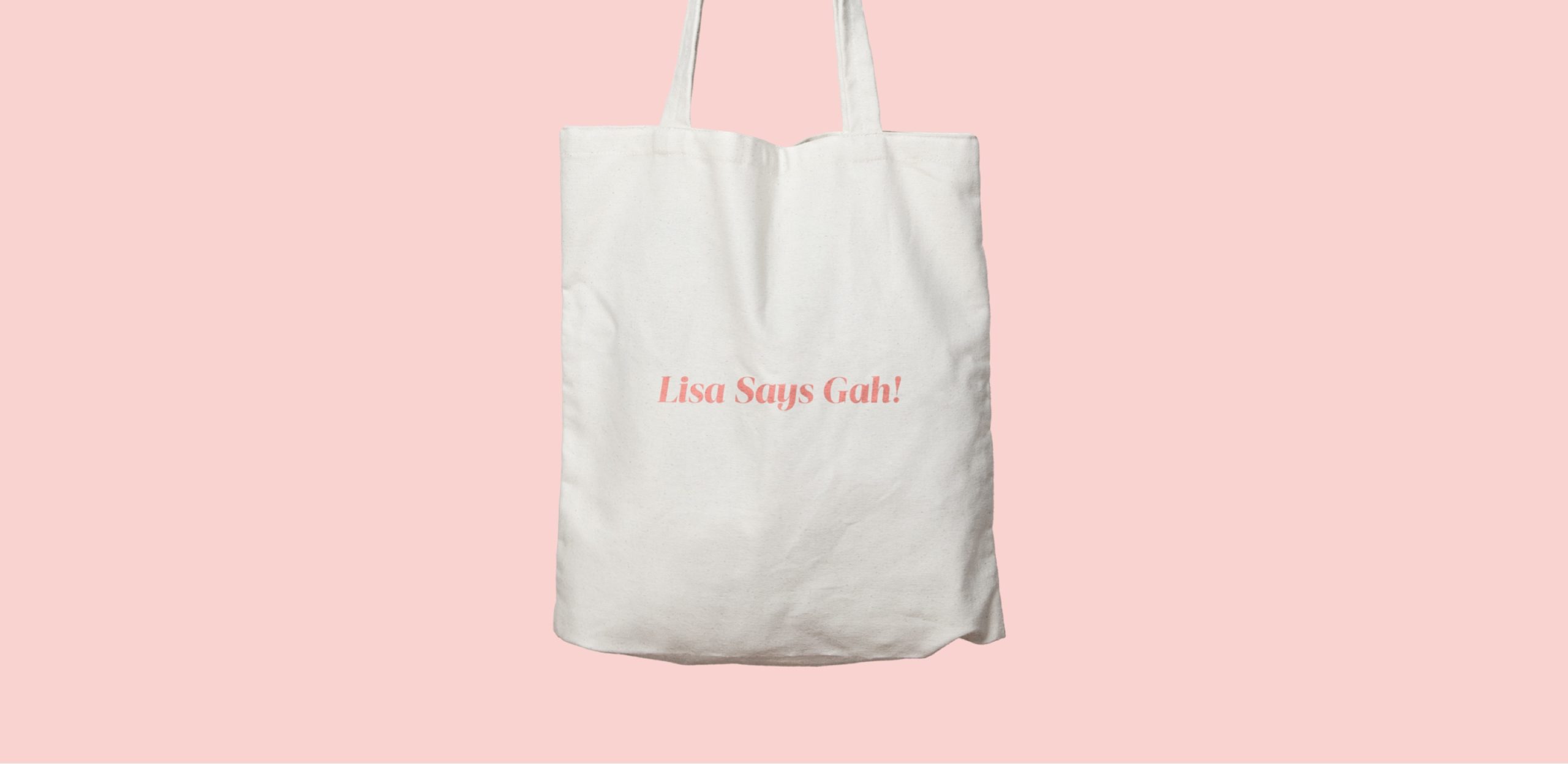 White fabric bag on pink background