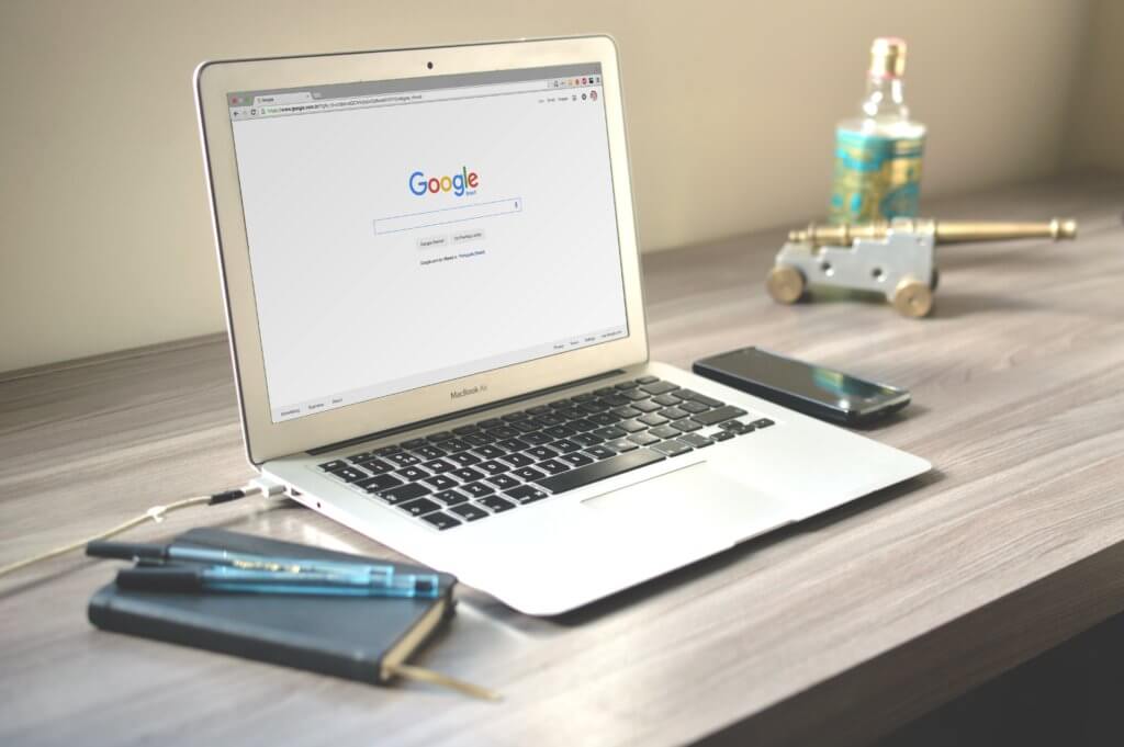macbook with google homepage. How to Write Product Descriptions That Boost Sales